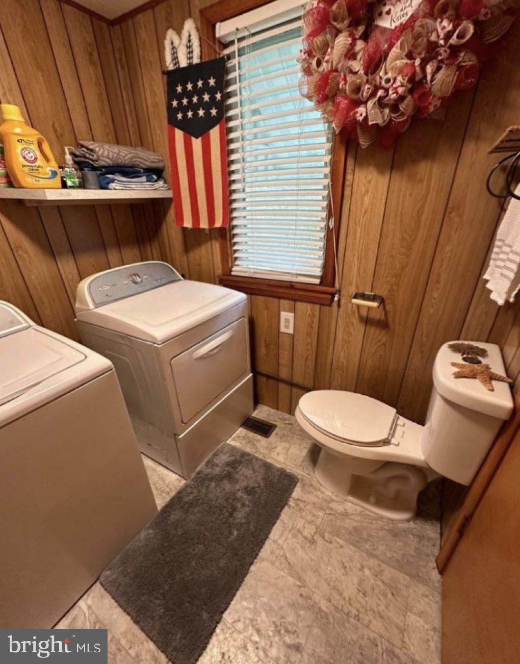 409 Myrtle Street Crisfield, MD 21817 - Photo 17 of 19 a bathroom with a sink a toilet and shower