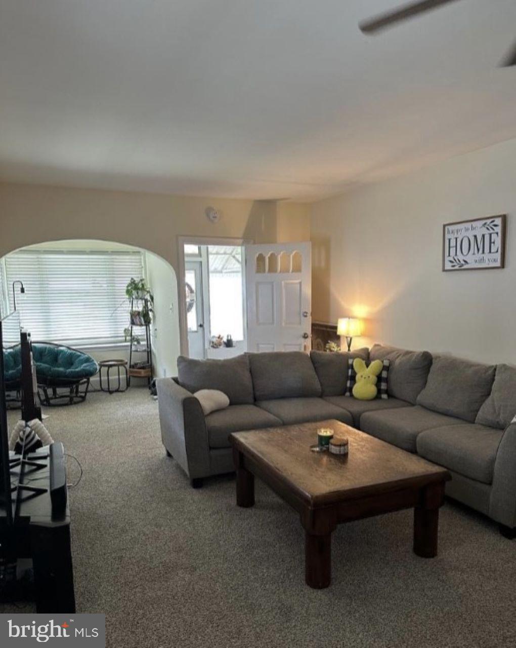 409 Myrtle Street Crisfield, MD 21817 - Photo 5 of 19 a living room with furniture and white walls