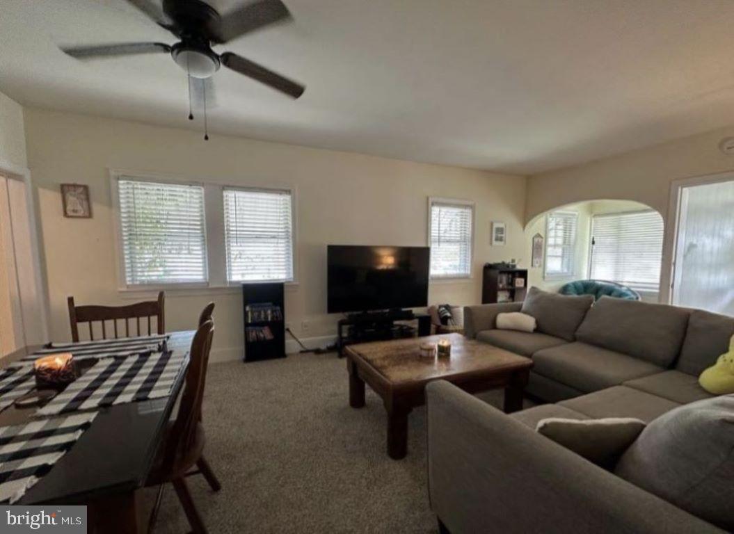 409 Myrtle Street Crisfield, MD 21817 - Photo 6 of 19 a living room with furniture and a flat screen tv