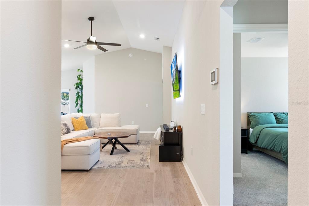 1204 Mezzavalle Way Auburndale, FL 33823 - Photo 13 of 42 a living room with furniture and a chandelier