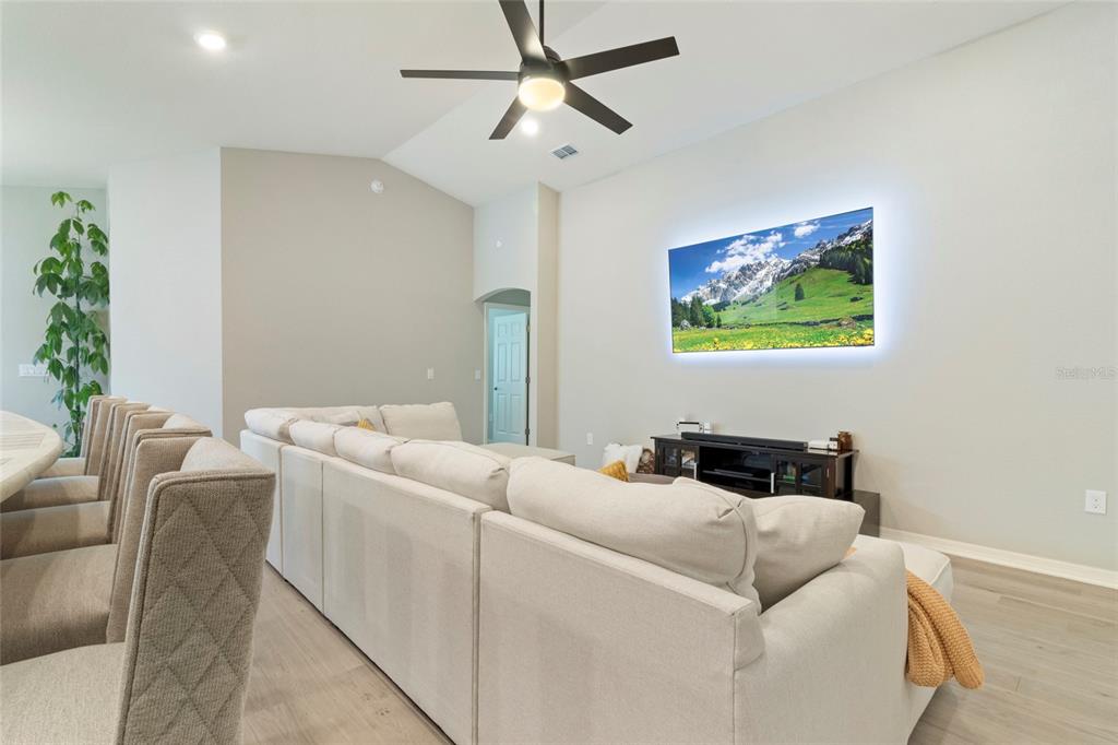 1204 Mezzavalle Way Auburndale, FL 33823 - Photo 14 of 42 a living room with furniture and a potted plant