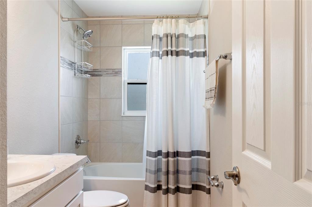 1204 Mezzavalle Way Auburndale, FL 33823 - Photo 17 of 42 a bathroom with a shower a bathtub and a toilet