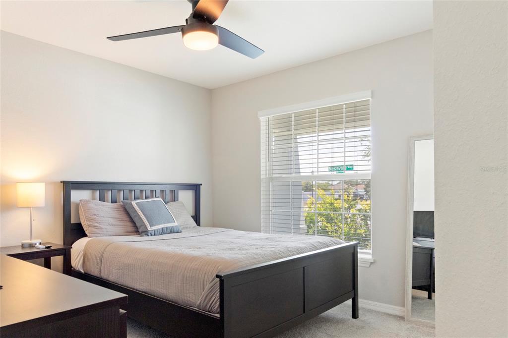1204 Mezzavalle Way Auburndale, FL 33823 - Photo 18 of 42 a bedroom with a bed and window