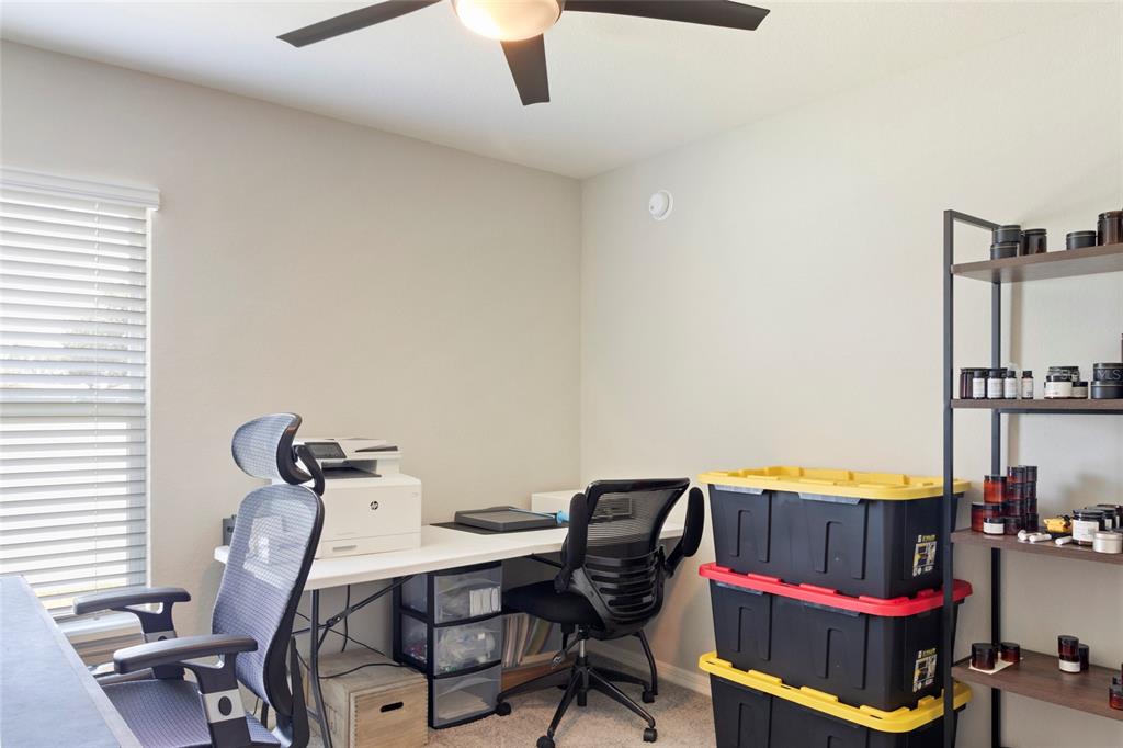 1204 Mezzavalle Way Auburndale, FL 33823 - Photo 19 of 42 a view of a workspace with furniture and a window