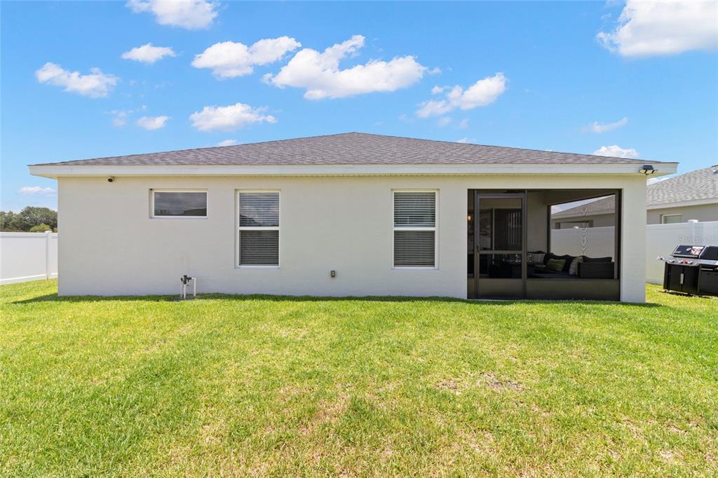 1204 Mezzavalle Way Auburndale, FL 33823 - Photo 28 of 42 a view of a house with yard and a garage