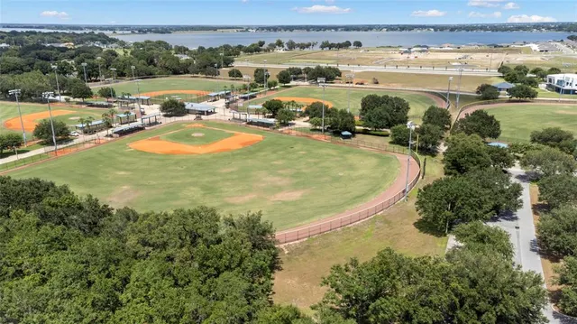 an aerial view of a house with a swimming pool
