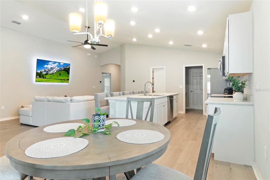 1204 Mezzavalle Way Auburndale, FL 33823 - Photo 3 of 42 a view of a dining room with furniture