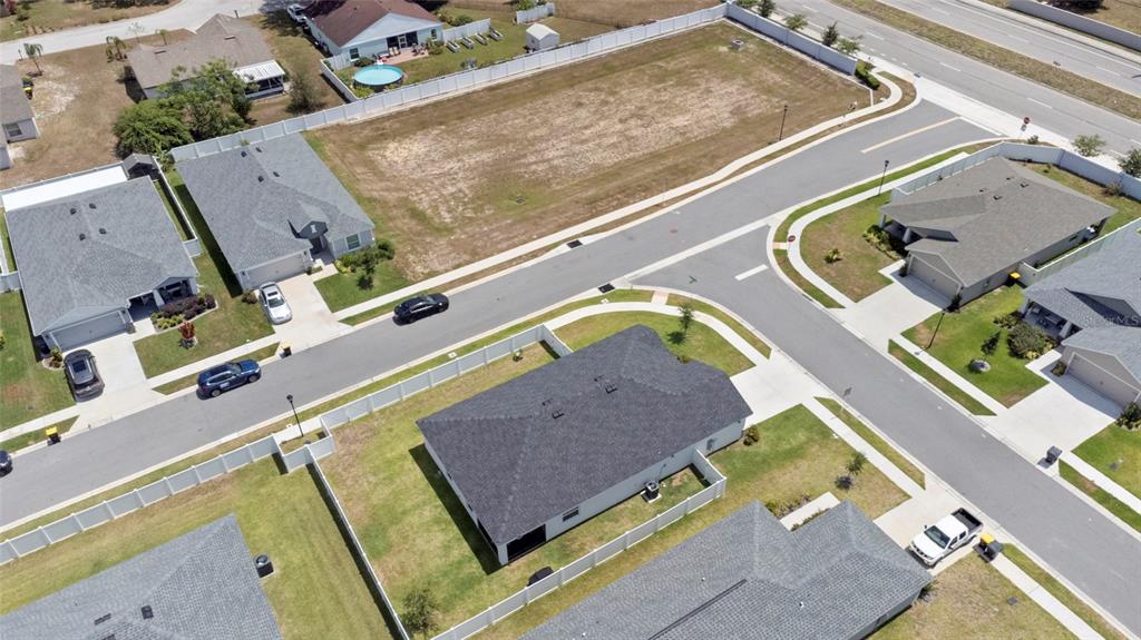 1204 Mezzavalle Way Auburndale, FL 33823 - Photo 32 of 42 an aerial view of a house with a swimming pool