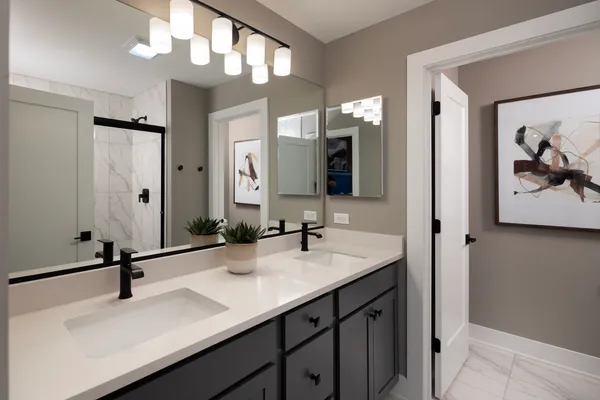 a bathroom with a sink a vanity and a mirror