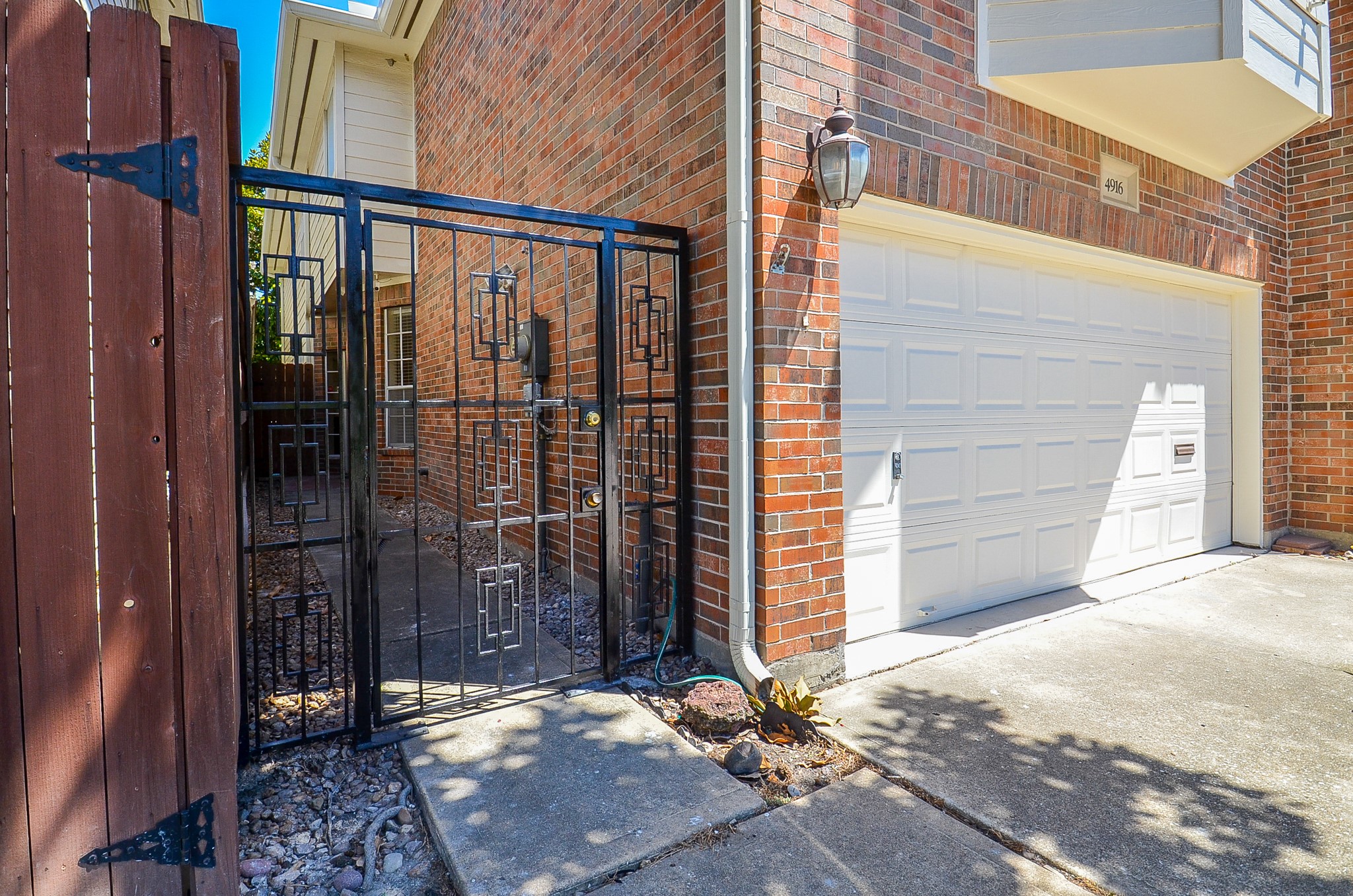 4916 Inker Street Houston, TX 77007 - Photo 2 of 36 Gated front entrance greets visitors - who have a double-wide driveway in which to park!