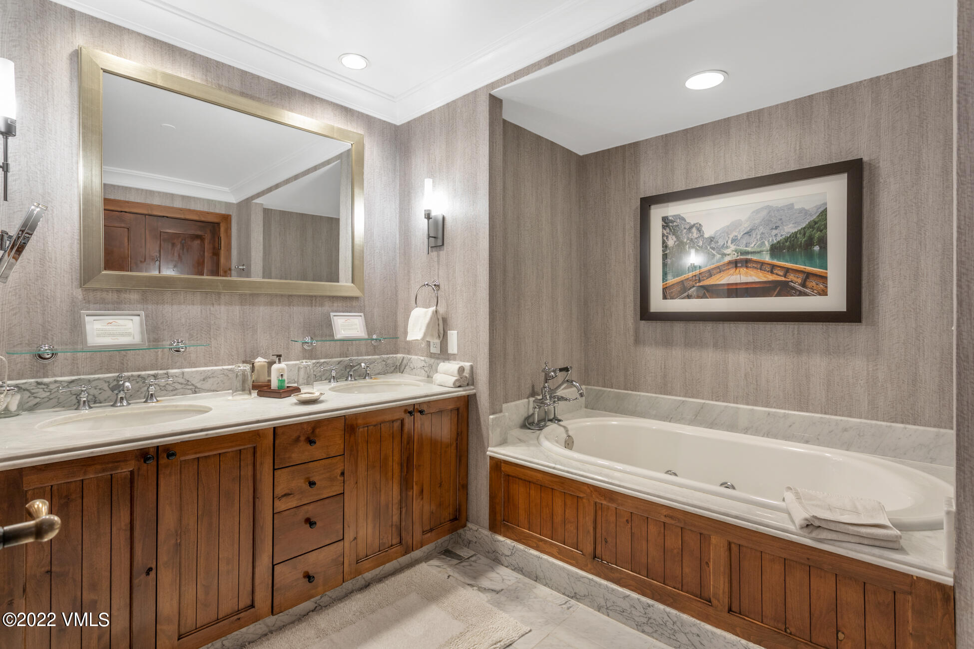100 Bachelor Ridge Road, Unit 3707 Avon, CO 81620 - Photo 16 of 41 a bathroom with a tub a sink and mirror