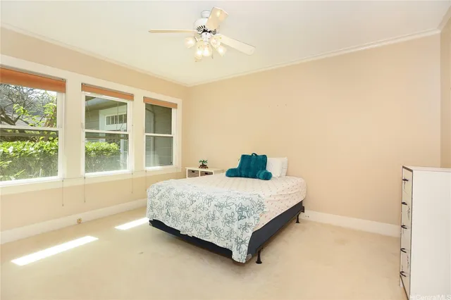 a spacious bedroom with a bed and a window