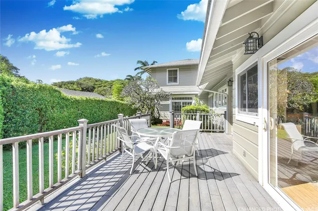 a view of a house with backyard porch and wooden floor