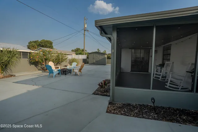 a view of a porch with furniture and a potted plant