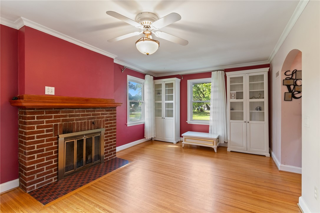 29 Avondale Road Irondequoit, NY 14622 - Photo 6 of 30 The living room- REAL BRICK fireplace- flanking display cabinets too!