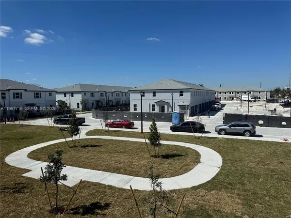 a swimming pool with outdoor seating and yard