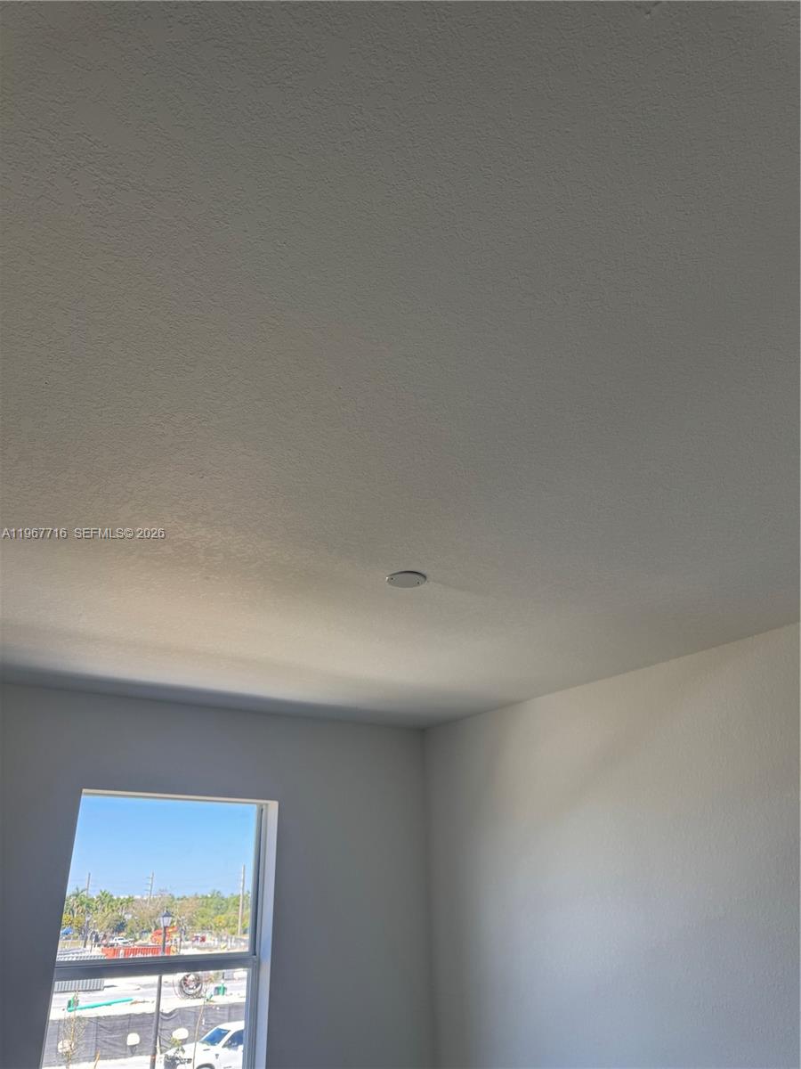 12420 Southwest 248th Street, Unit 4 Homestead, FL 33032 - Photo 17 of 20 a view of an empty room