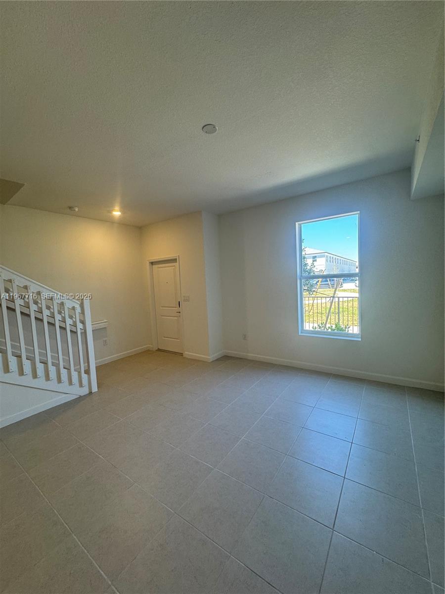 12420 Southwest 248th Street, Unit 4 Homestead, FL 33032 - Photo 20 of 20 an empty room with windows