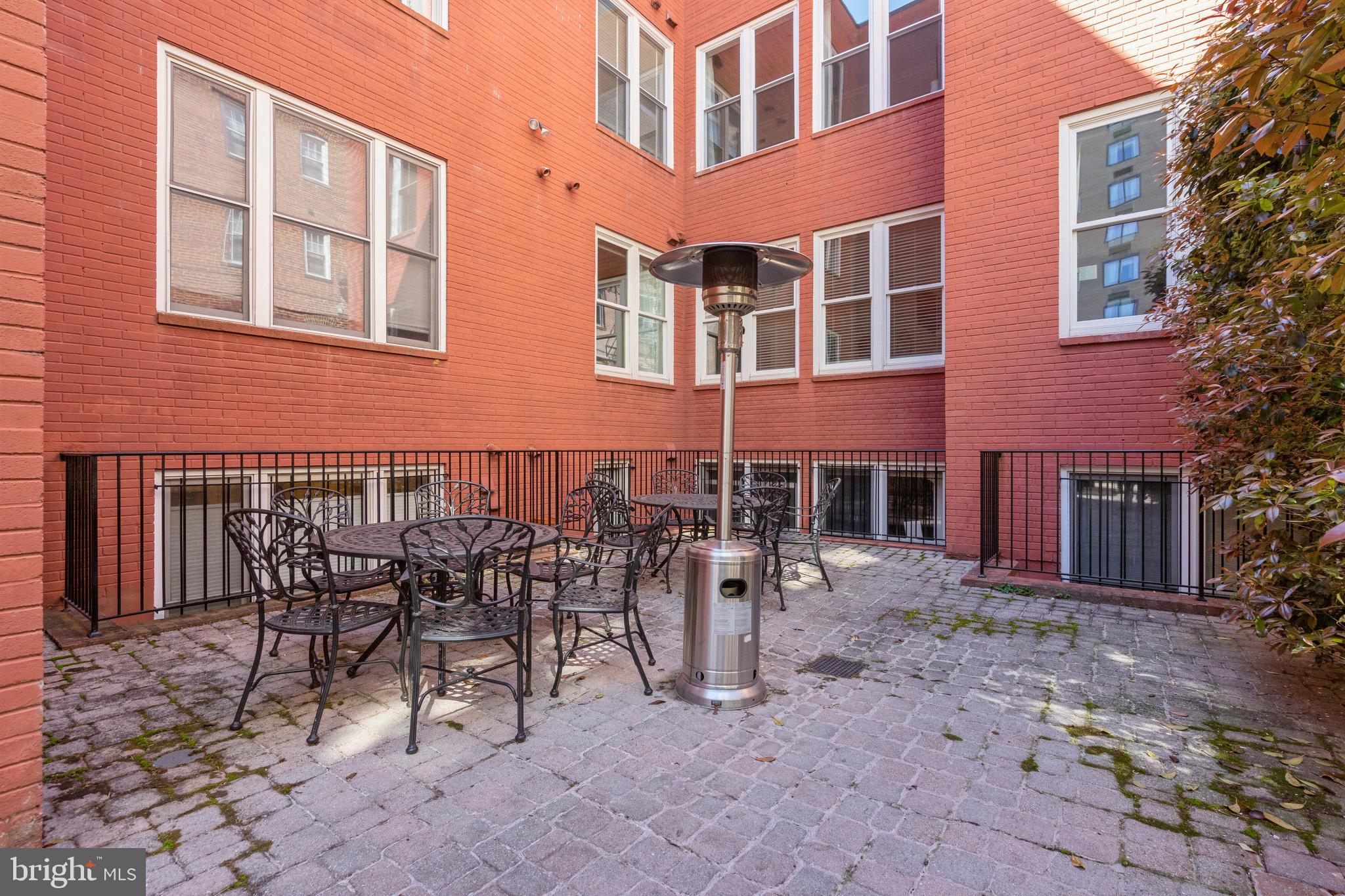 1520 O Street Northwest, Unit T8 Washington, DC 20005 - Photo 16 of 20 Shared outdoor patio w/ tables, chairs, and grills