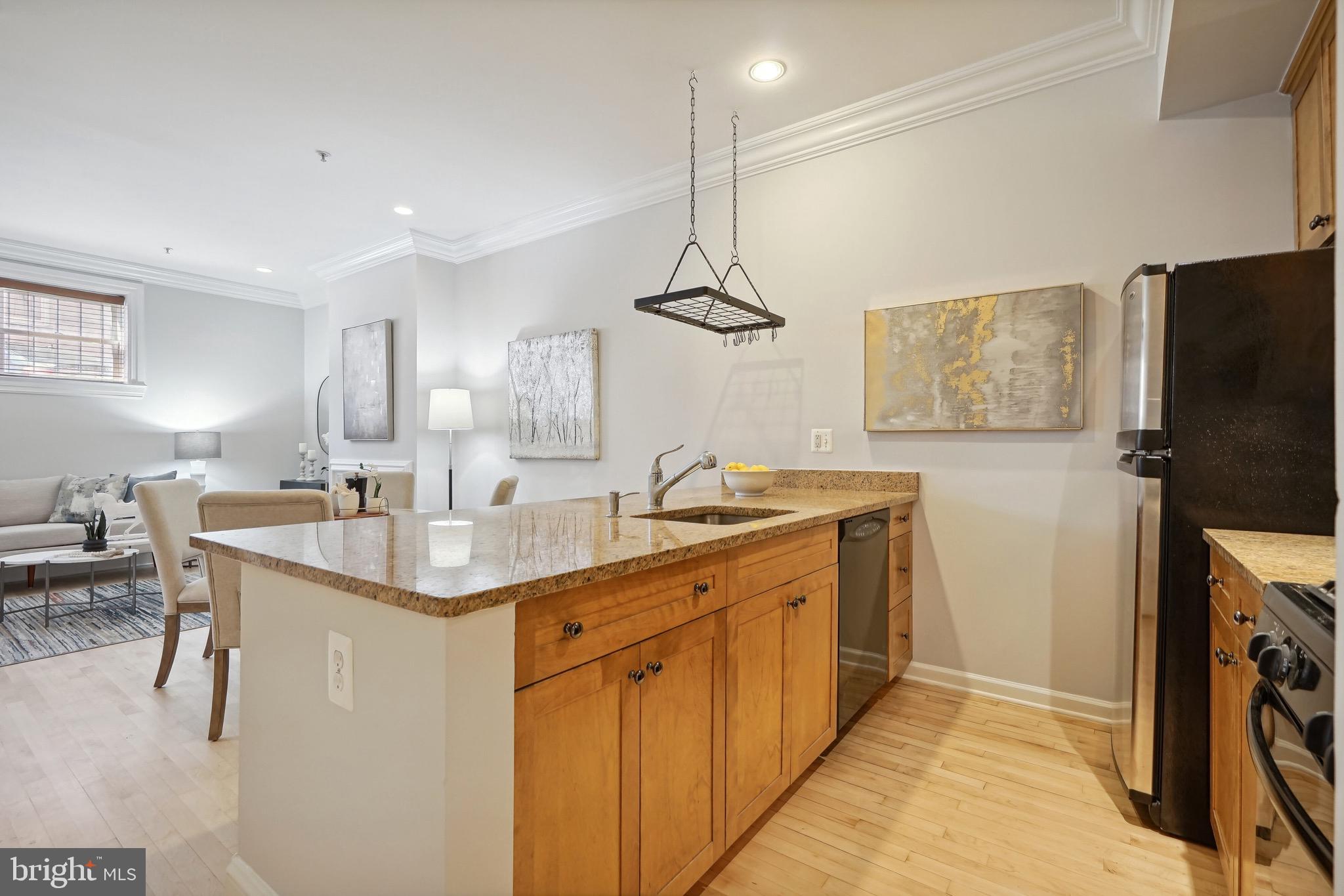 1520 O Street Northwest, Unit T8 Washington, DC 20005 - Photo 4 of 20 Open kitchen with maple cabinets