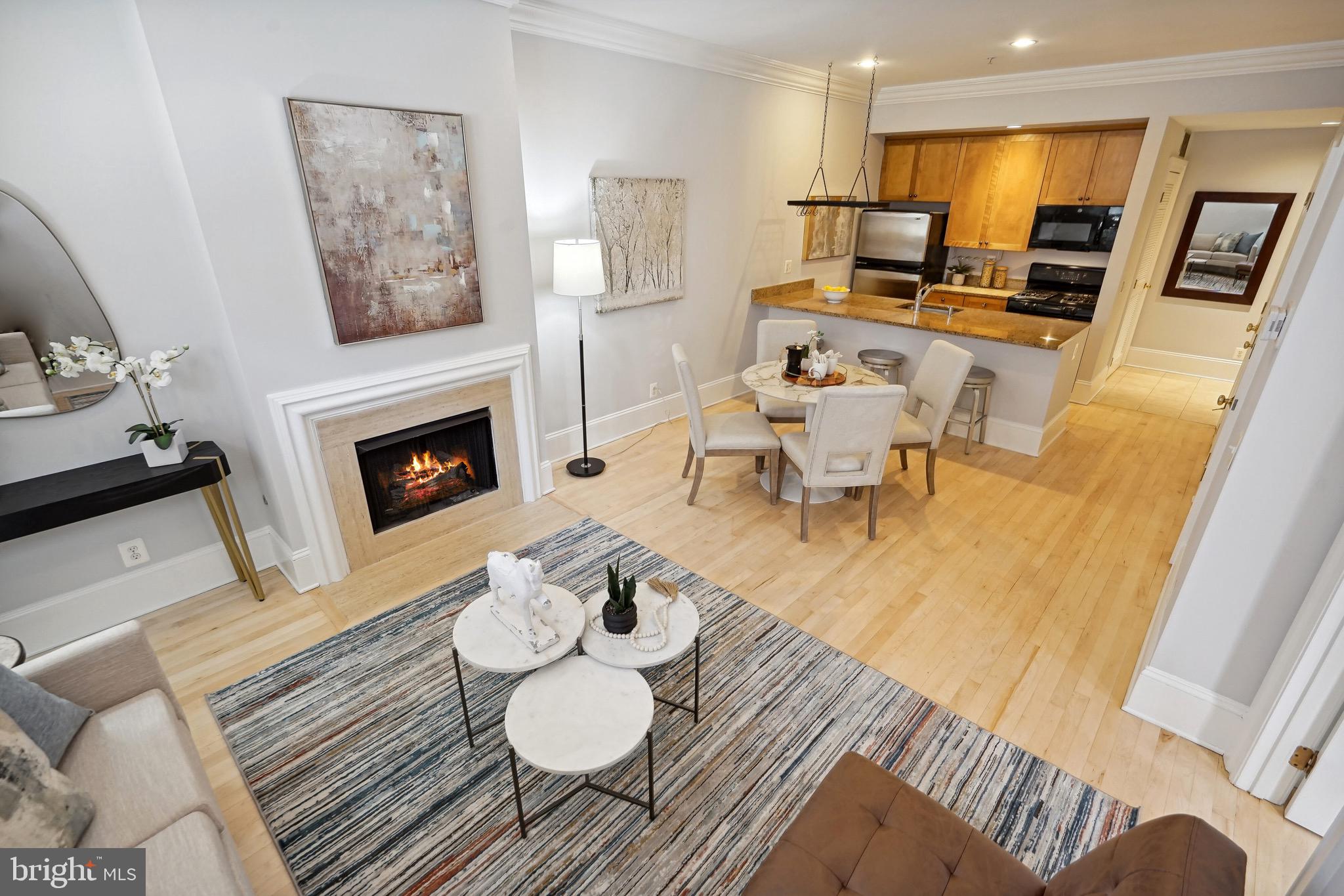 1520 O Street Northwest, Unit T8 Washington, DC 20005 - Photo 8 of 20 Open living area offers a gas fireplace