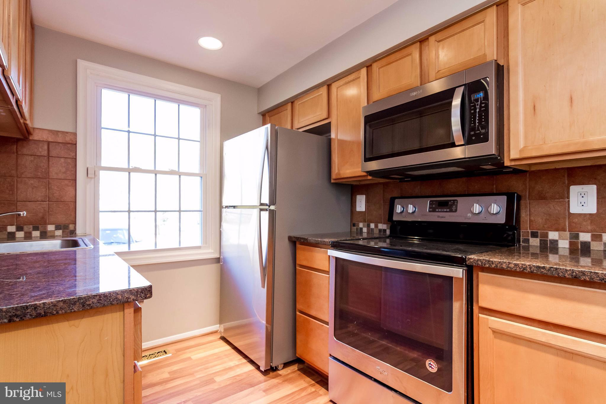 8030 Grandview Court Springfield, VA 22153 - Photo 9 of 27 Kitchen- granite counter tops, pergo floor