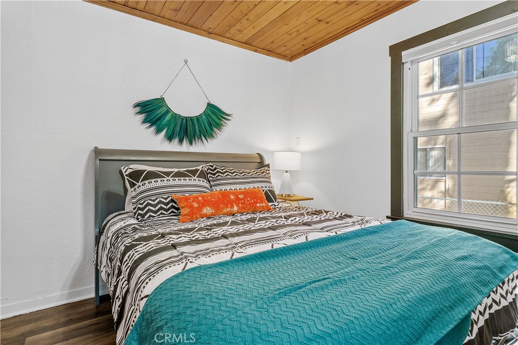 660 Barrett Way Big Bear City, CA 92314 - Photo 19 of 32 a bedroom with a bed and a window