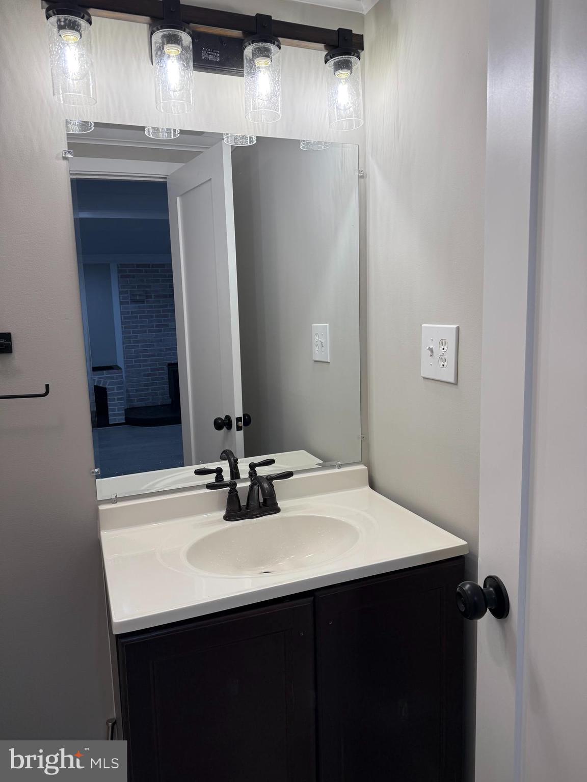 453 Walnut Drive Edgewater, MD 21037 - Photo 12 of 46 a bathroom with a sink and a mirror