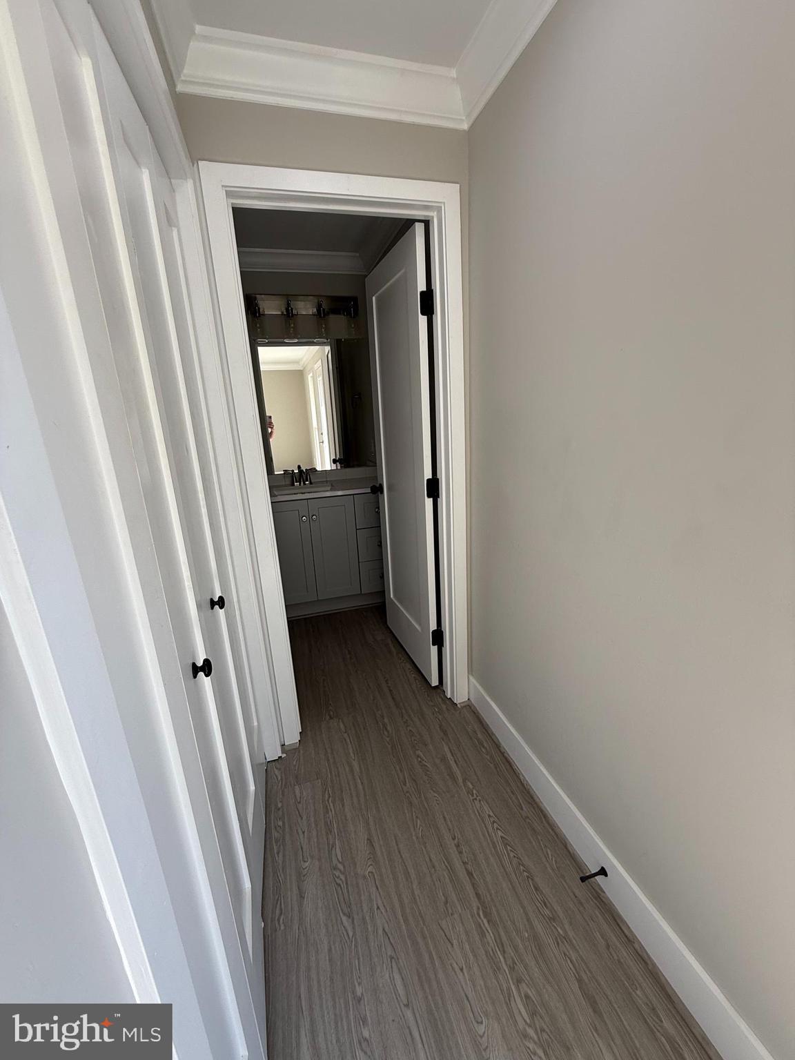 453 Walnut Drive Edgewater, MD 21037 - Photo 14 of 46 a view of a hallway with wooden floor and stairs