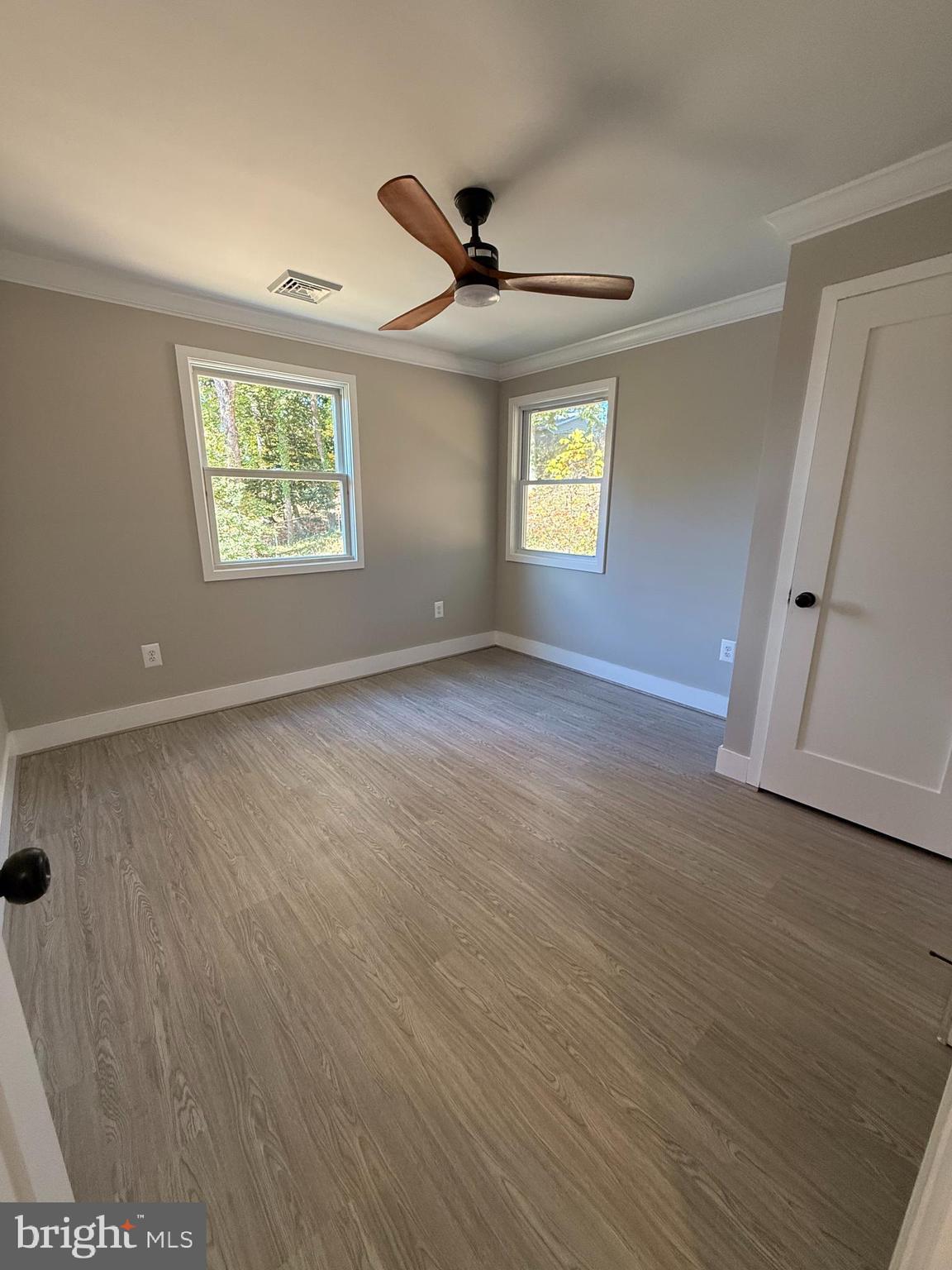 453 Walnut Drive Edgewater, MD 21037 - Photo 16 of 46 wooden floor in an empty room with a window