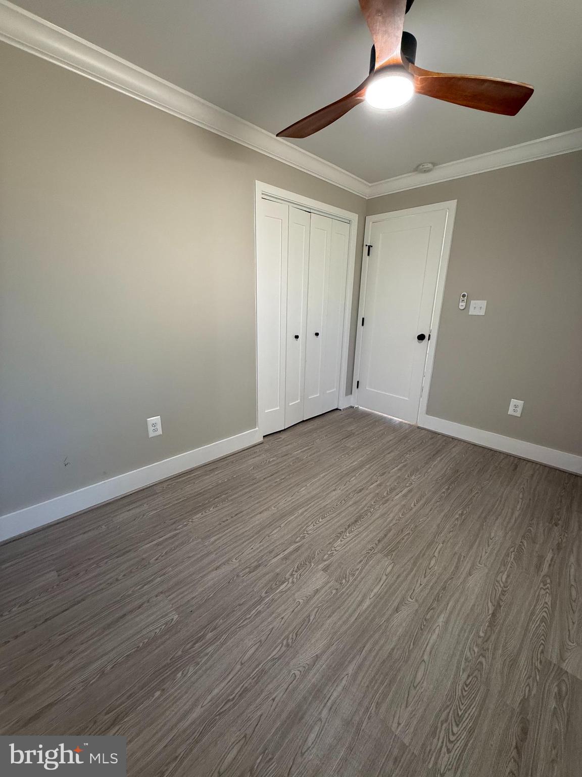 453 Walnut Drive Edgewater, MD 21037 - Photo 17 of 46 a view of an empty room with wooden floor