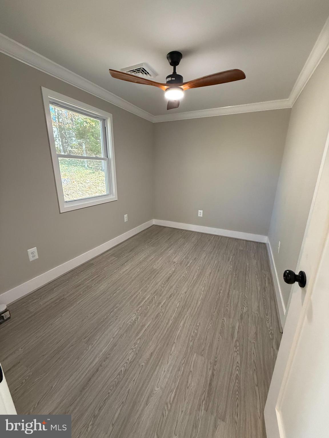 453 Walnut Drive Edgewater, MD 21037 - Photo 18 of 46 wooden floor in an empty room with a window