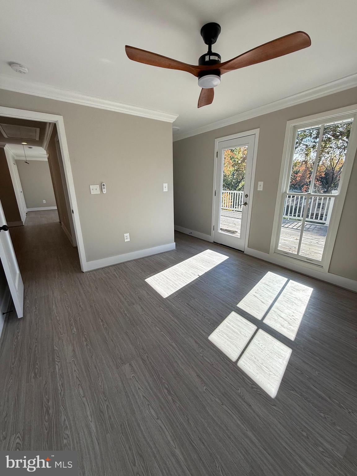 453 Walnut Drive Edgewater, MD 21037 - Photo 20 of 46 a view of an empty room with window and wooden floor