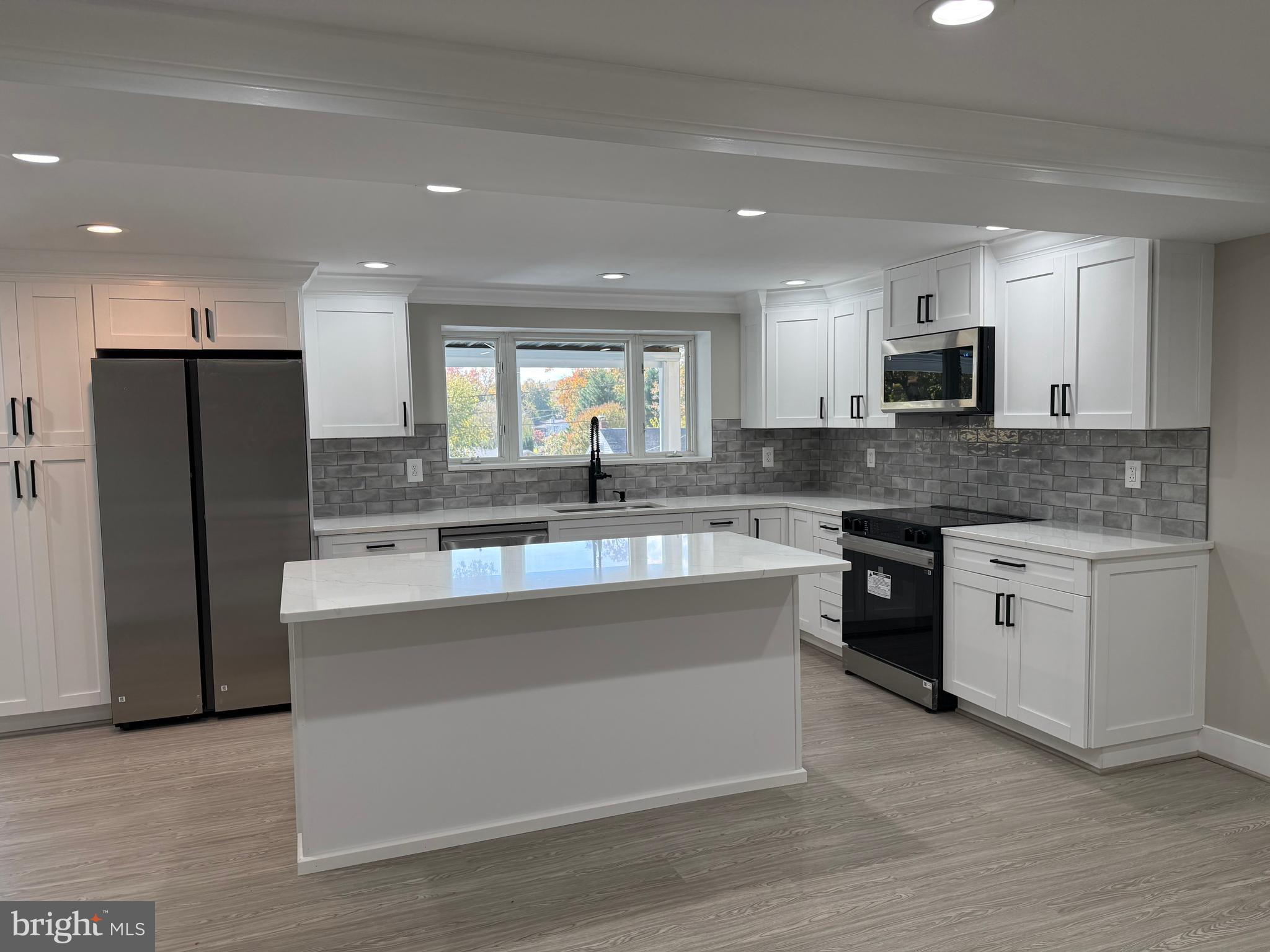453 Walnut Drive Edgewater, MD 21037 - Photo 2 of 46 a large kitchen with stainless steel appliances granite countertop a stove a sink and a refrigerator