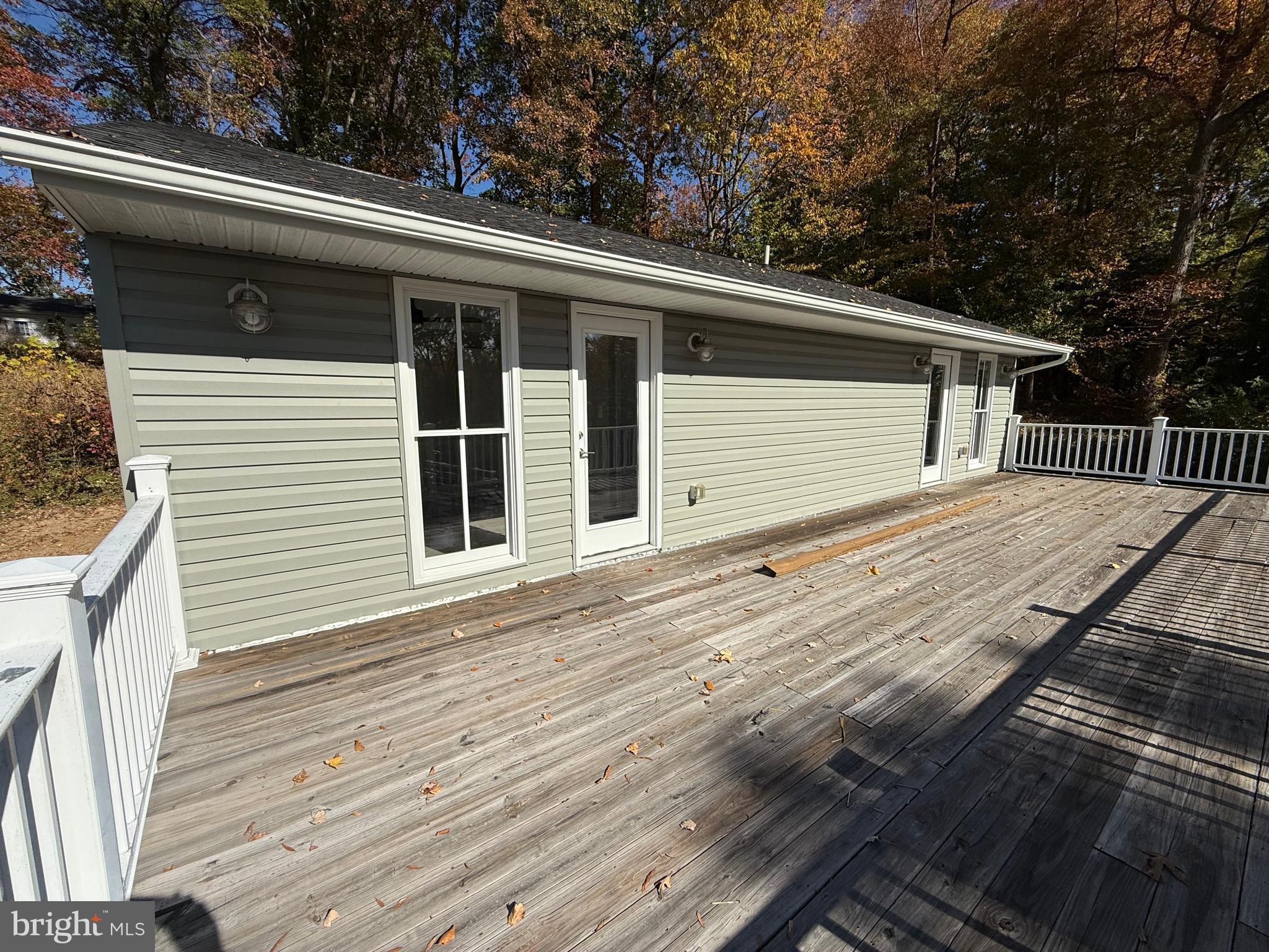 453 Walnut Drive Edgewater, MD 21037 - Photo 21 of 46 a view of a house with a roof deck