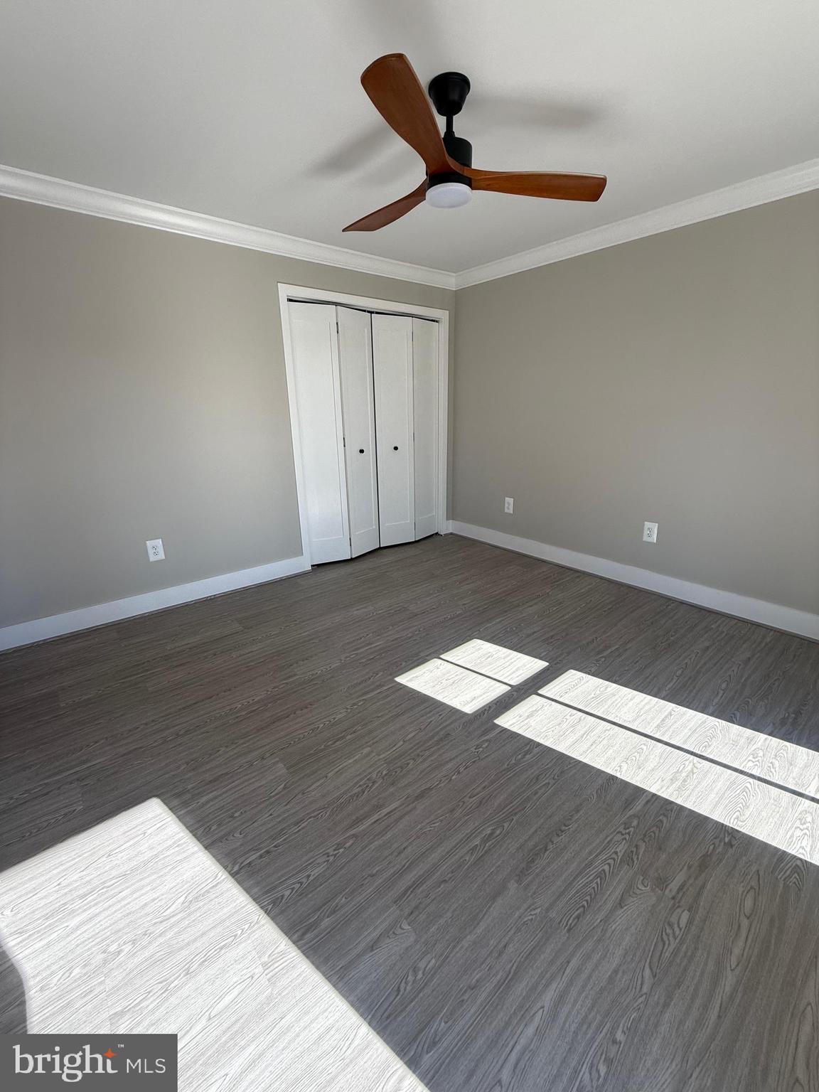 453 Walnut Drive Edgewater, MD 21037 - Photo 23 of 46 a view of an empty room with wooden floor and a window