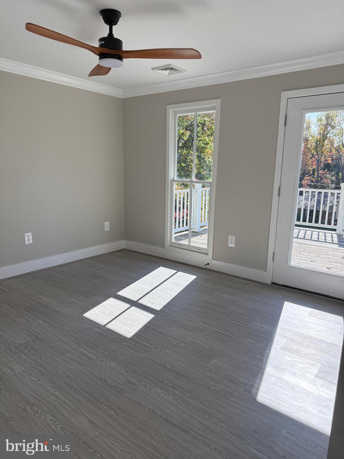 453 Walnut Drive Edgewater, MD 21037 - Photo 24 of 46 a view of an empty room with wooden floor and a window