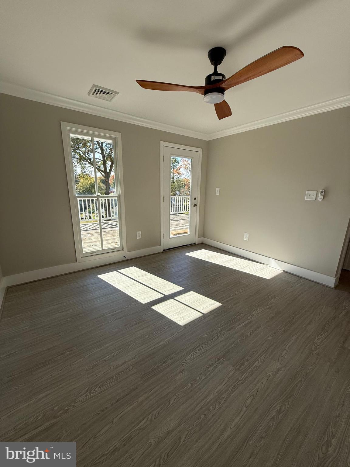 453 Walnut Drive Edgewater, MD 21037 - Photo 25 of 46 a view of an empty room with wooden floor and a window