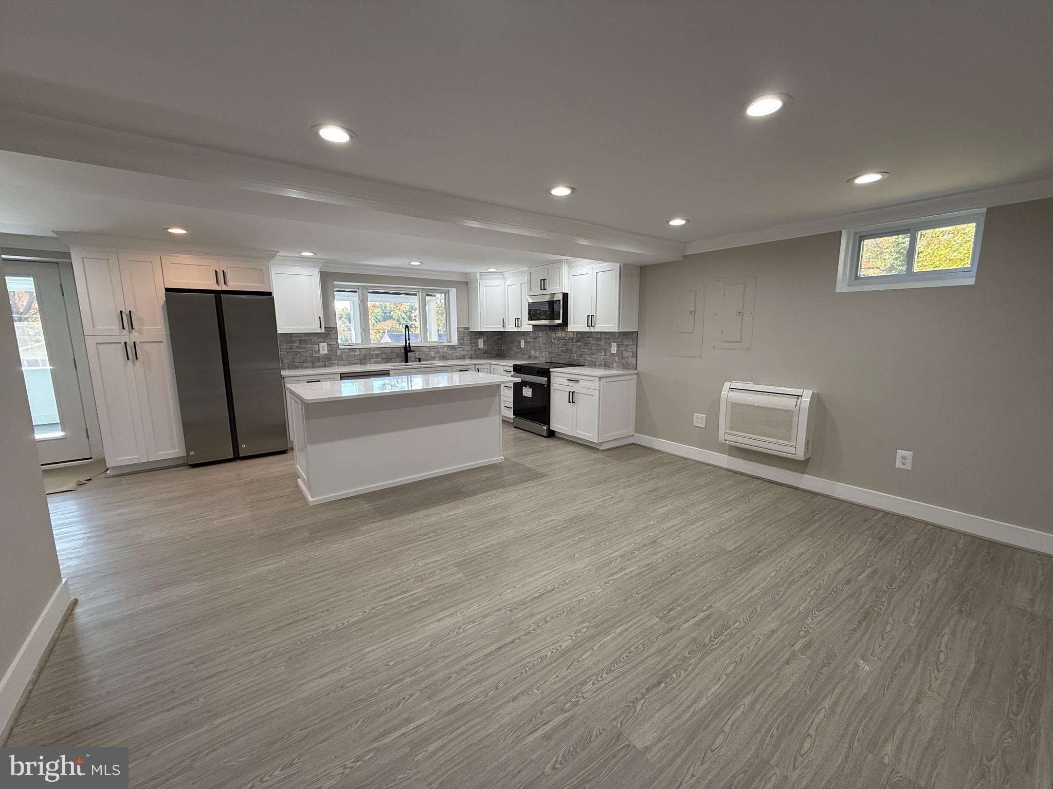 453 Walnut Drive Edgewater, MD 21037 - Photo 27 of 46 a view of kitchen with refrigerator microwave and cabinets