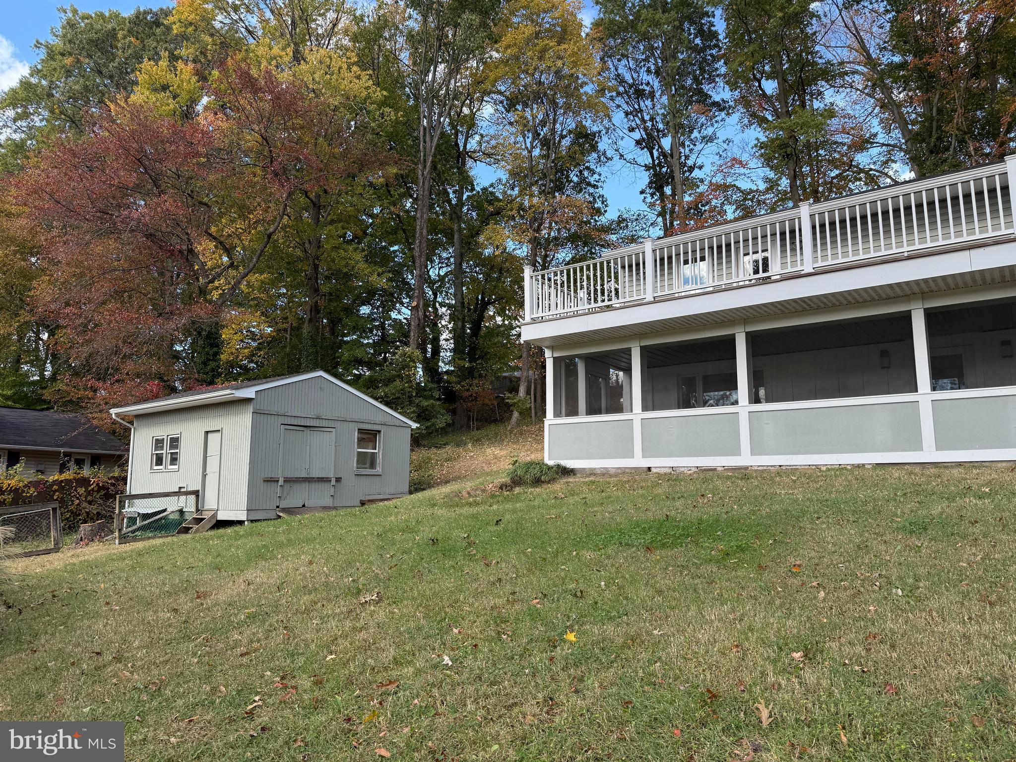 453 Walnut Drive Edgewater, MD 21037 - Photo 42 of 46 a view of a house with a yard and large trees