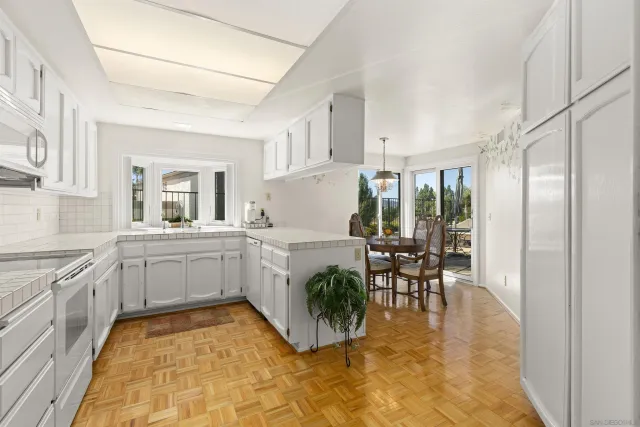 a kitchen with stainless steel appliances cabinets a sink and a stove