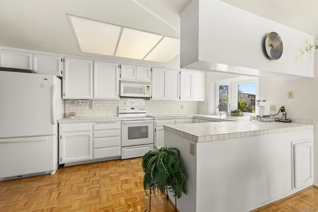 a bathroom with a sink a mirror and a bathtub