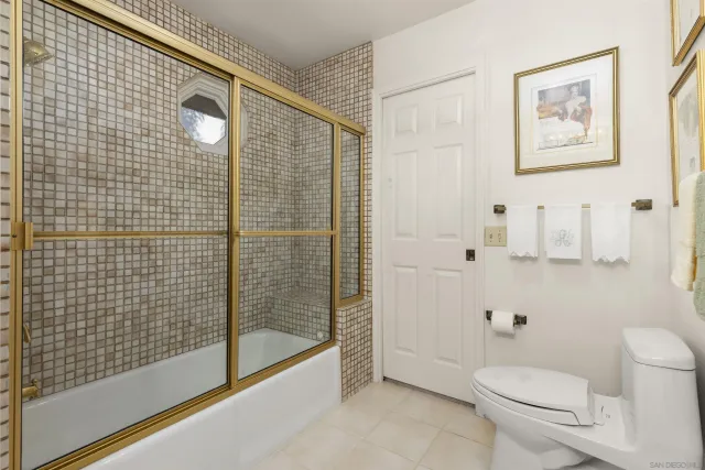 a view of a livingroom with workspace and a window