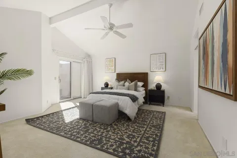 a white toilet sitting next to a white wall