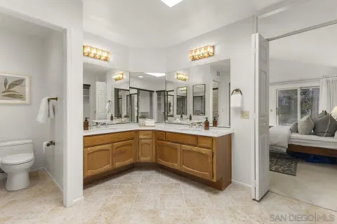 a bathroom with a shower and toilet