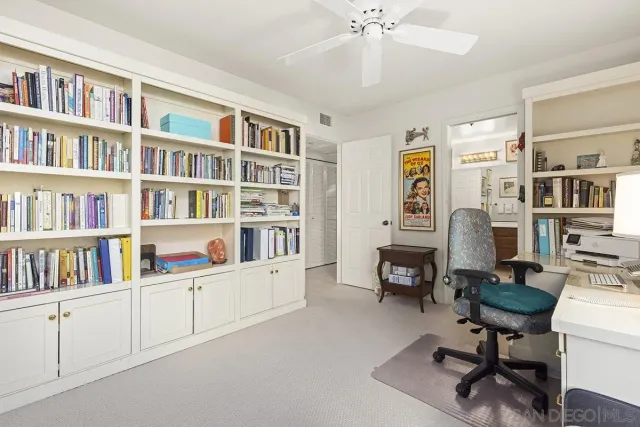 a view of a town with mountains in the background