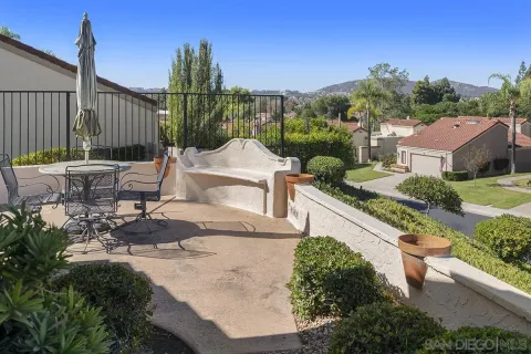 an aerial view of residential houses and outdoor space