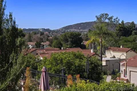 an aerial view of residential house and green space