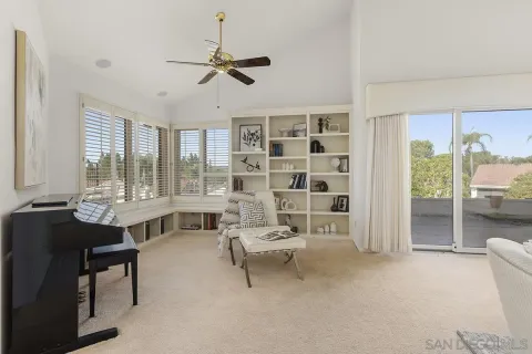 a living room with furniture and flat screen tv