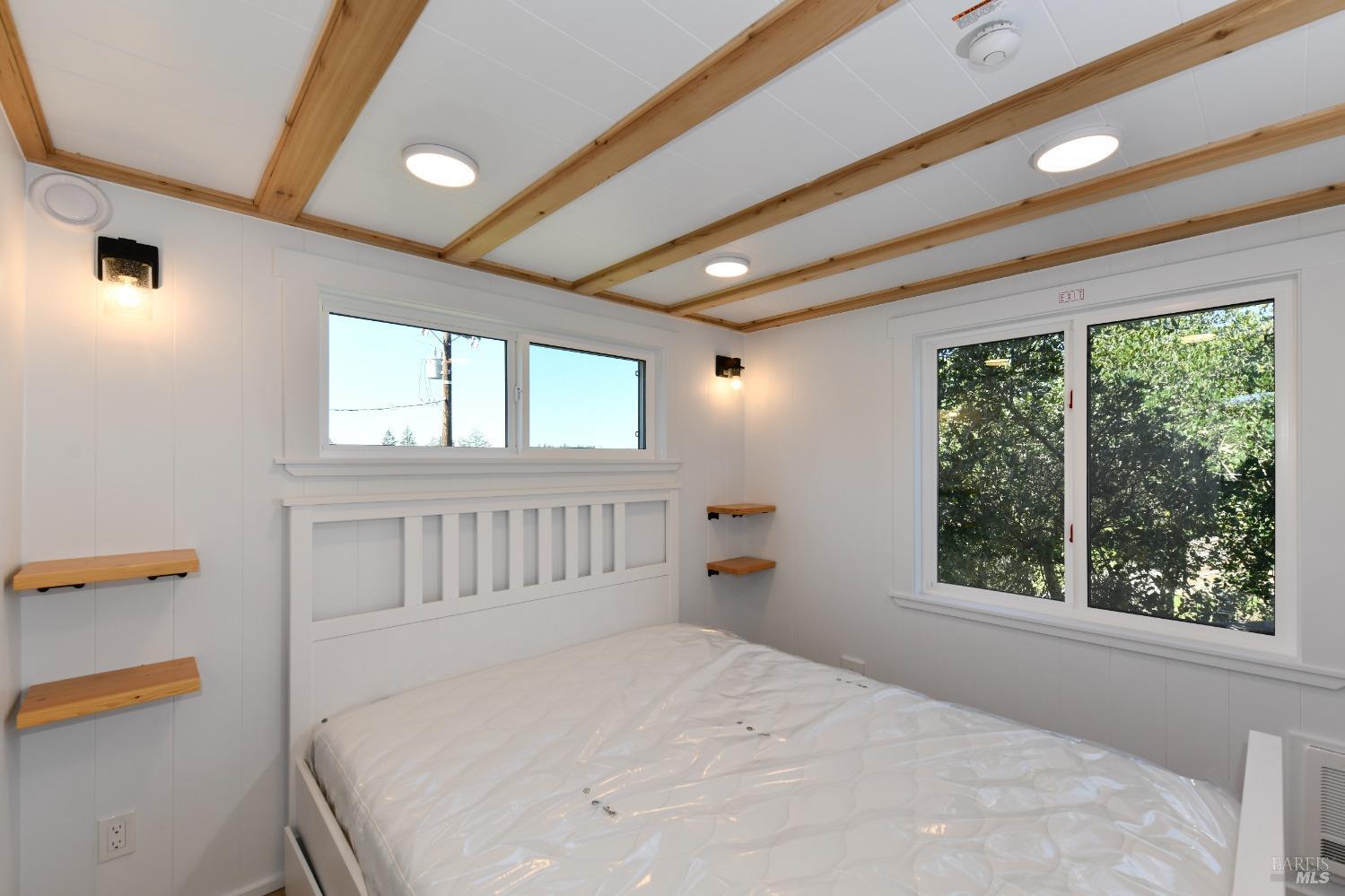 1033 Sundown Trail Santa Rosa, CA 95404 - Photo 22 of 45 a bedroom with a bed next to a window